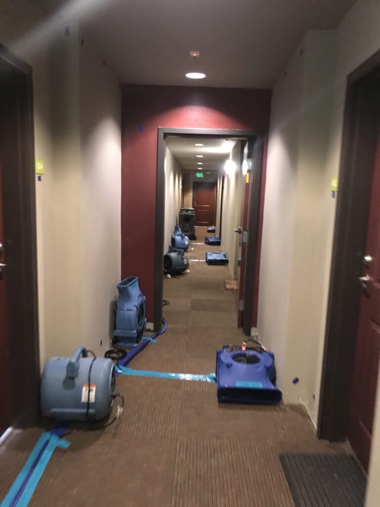 A hallway with scattered equipment